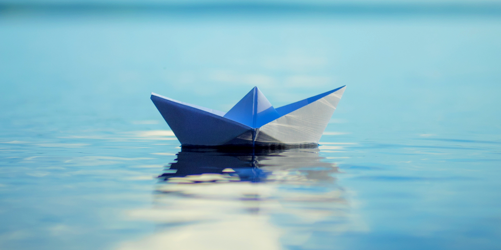 Paper boat in the ocean